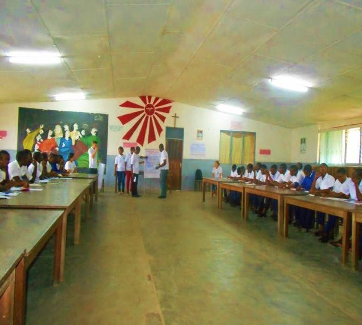 Community members gathered at a village facility